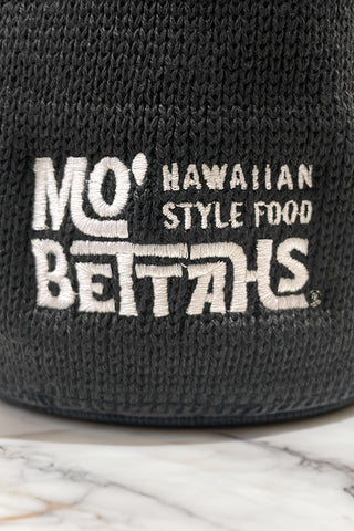 Close up on stitching of Mo' Bettahs Hawaiian Style Food logo on North Face Asphalt Grey Beanie.