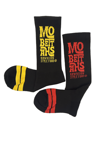 Black socks with yellow and red text and stripes on a white background