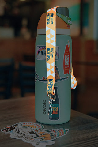Mo' Bettahs Lanyard draped over water bottle with Mo' Bettahs stickers..