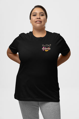 Woman wearing black T-Shirt, with Mo' Bettahs Shaka graphic on upper left breast.