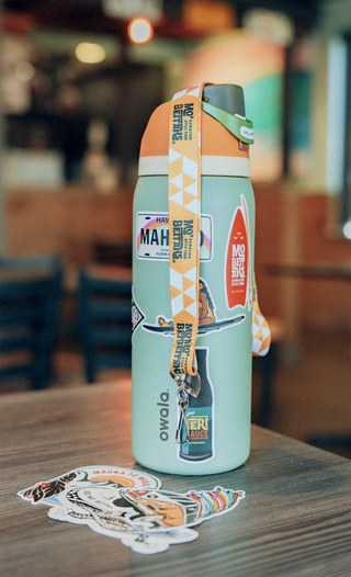 Water bottle with Mo' Bettahs stickers and lanyard.