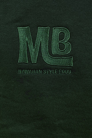 Close up of embroidered MB logo on Forest Green sweatshirt.