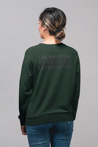 Back view of female model wearing Forest Green sweatshirt, showing screen printed Live, Be, and Eat Mo' Bettahs slogan.